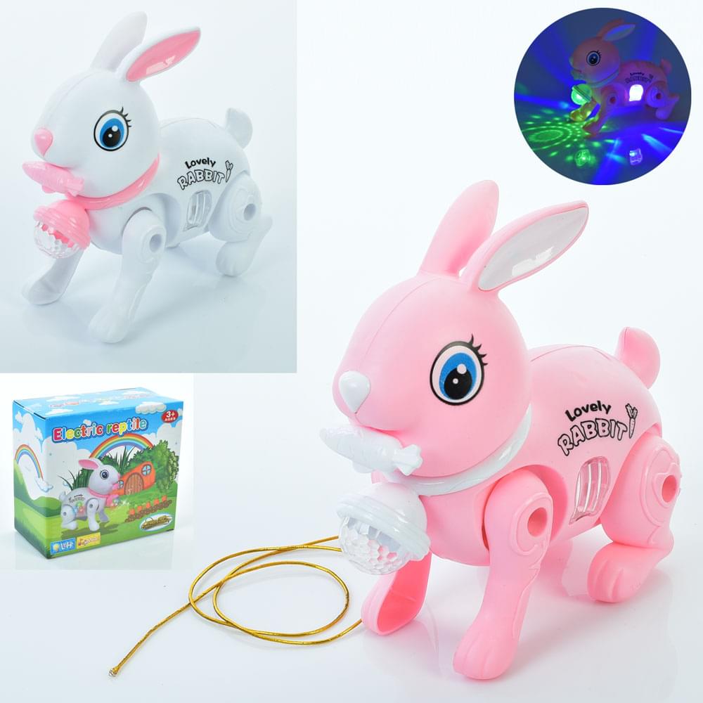 Музична іграшка заєць 16см, ходить, музика, світло, 2 кольори, на бат-ці, в кор-ці, 16-14,5-8см /72/