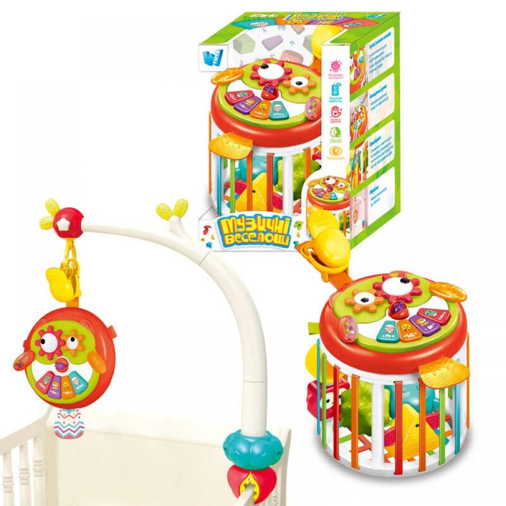 Гра "Музичні веселощі" "WToys", ОЗВУЧ. УКР. МОВОЮ, пісні, казки, вірші, тваринки, підсвічування, режими гучності, тріскачка, брязкальце, шелесткі елементи, фігурки, прорізувач, підвіска, в кор. /24-2/